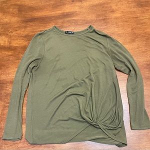 Greyish green long sleeve with twist at the bottom